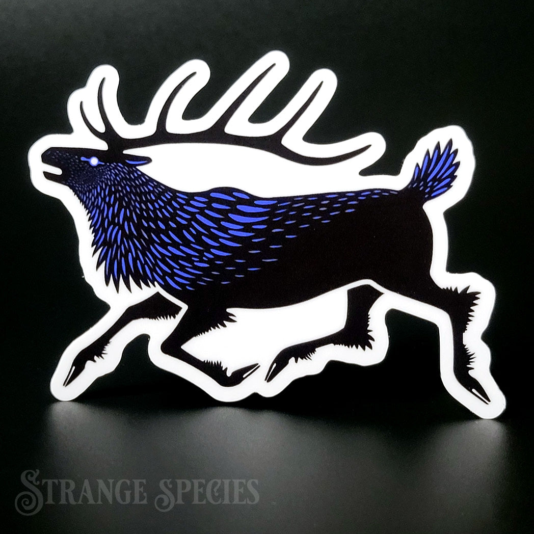 A sticker depicting a stylized elk, covered in raven feathers, drawn in black and blue in a folk art style