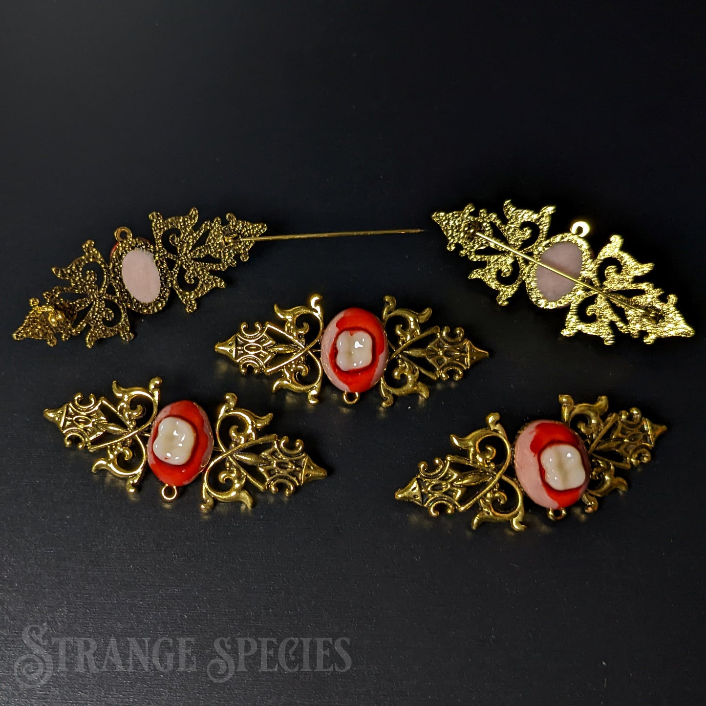 Ornate Gold-Toned Bloody-Toothed Brooch