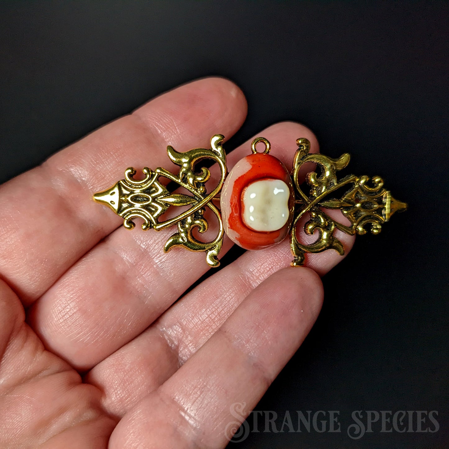 Ornate Gold-Toned Bloody-Toothed Brooch