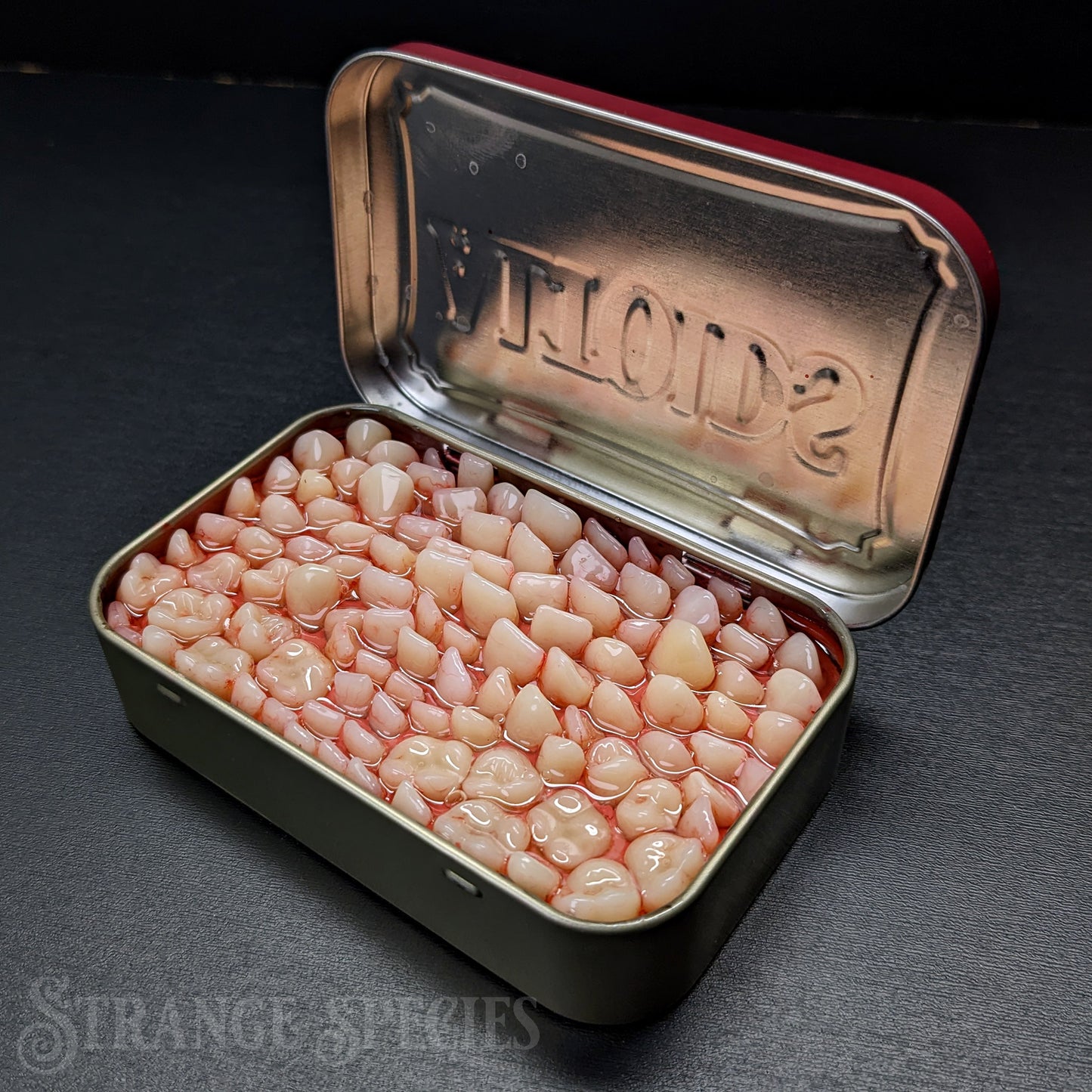 Tins Full of Teeth